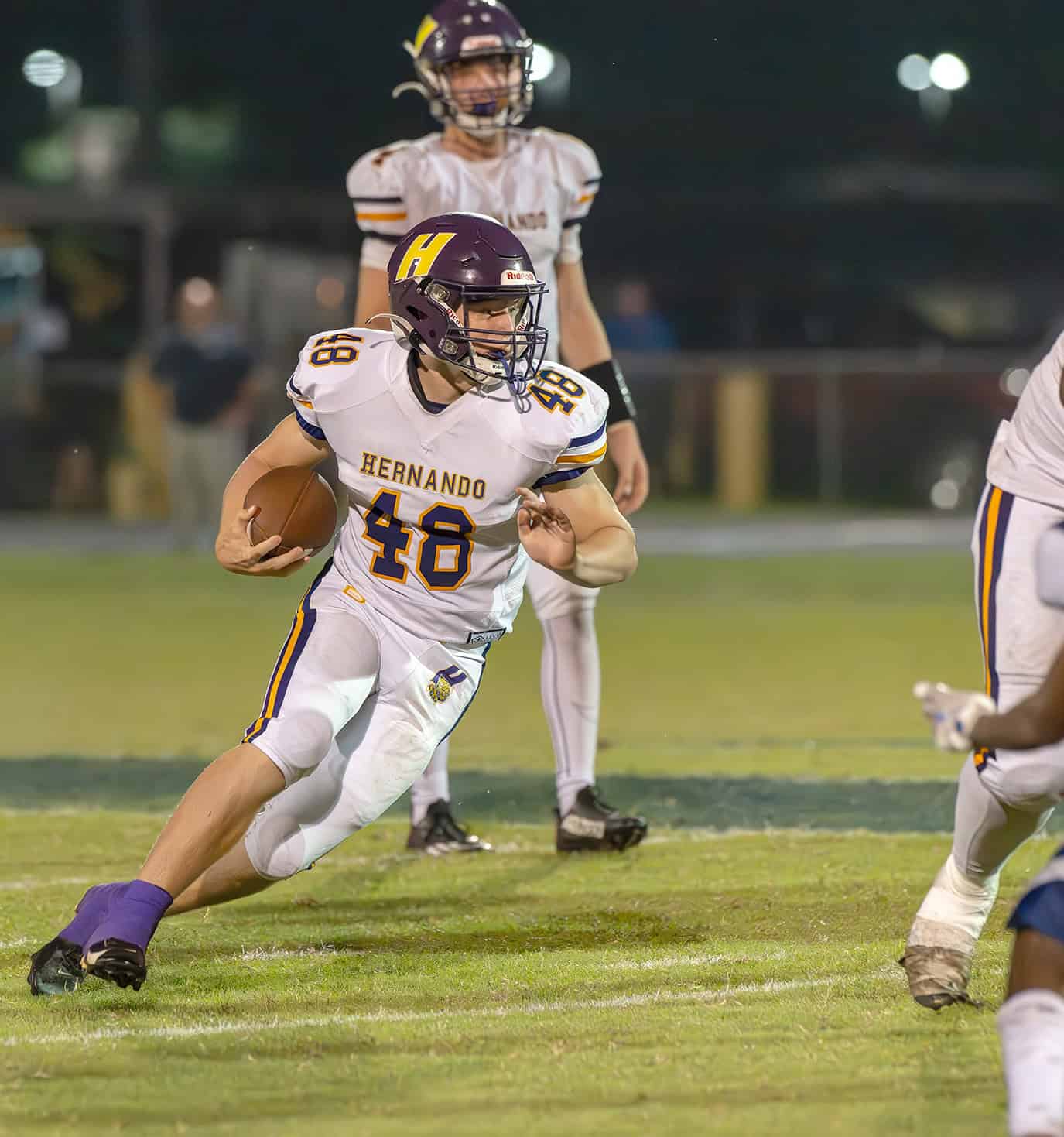 Hernando High, 48, Mason Pauliot finds running room in the game with Central High. [Photo by Joe DiCristofalo]