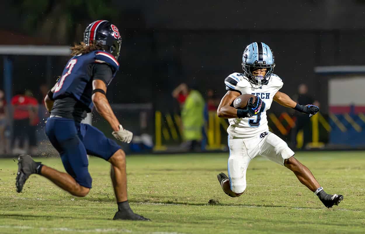 Nature Coast Tech, 9, Jasir Harvin tries to evade a tackle by Springstead, 4, Xylus Pastrana Friday at Booster Stadium. [Photo by Joseph DiCristofalo]