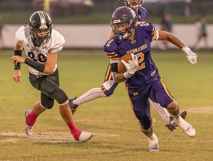 Hernando High, 2, Gabriel Sansone runs around end for a gain versus Citrus High. [Credit; Joe DiCristofalo]