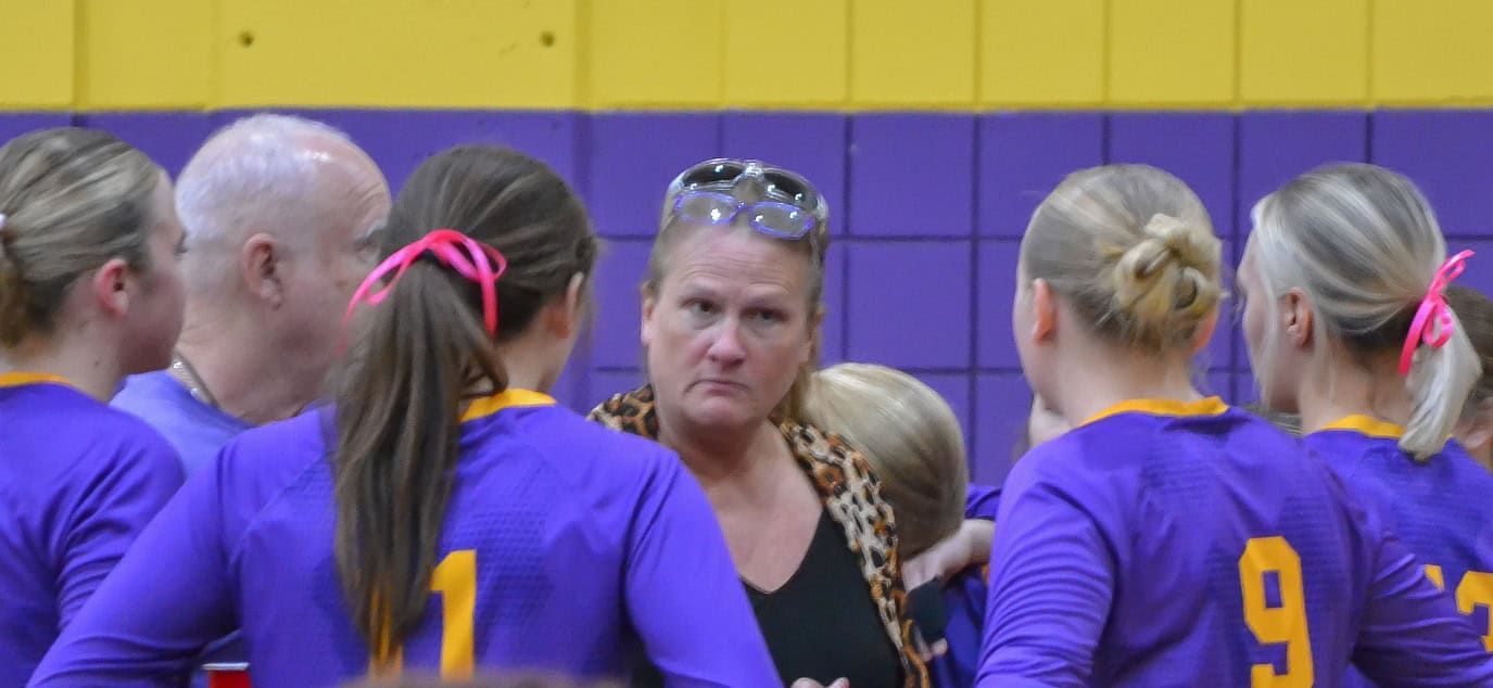 The Hernando High volleyball team huddles around head coach Robin Bailey between games on Thursday night against Nature Coast. [Credit: Chris Bernhardt Jr.]