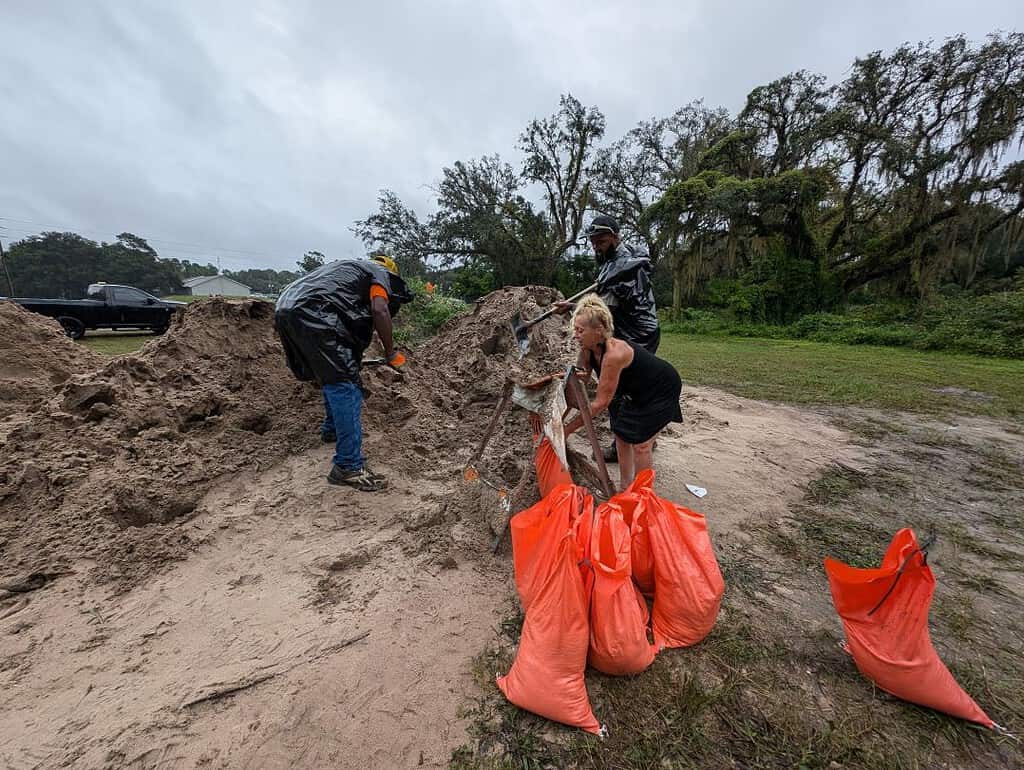 Cindy Pruiett filling sandbags for her house. [Credit: Hanna Maglio]