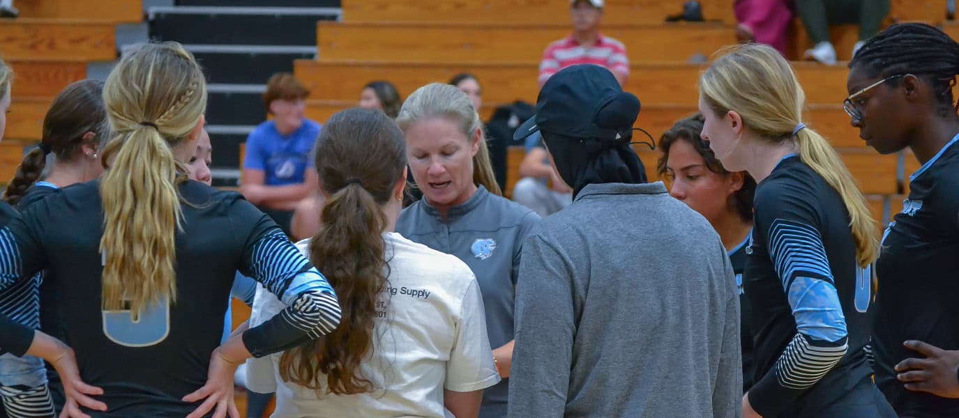 Nature Coast head coach Emily Gore speaks to her team during a timeout in Thursday's District 4A-8 Tournament final at Hernando. [Credit: Chris Bernhardt Jr.]