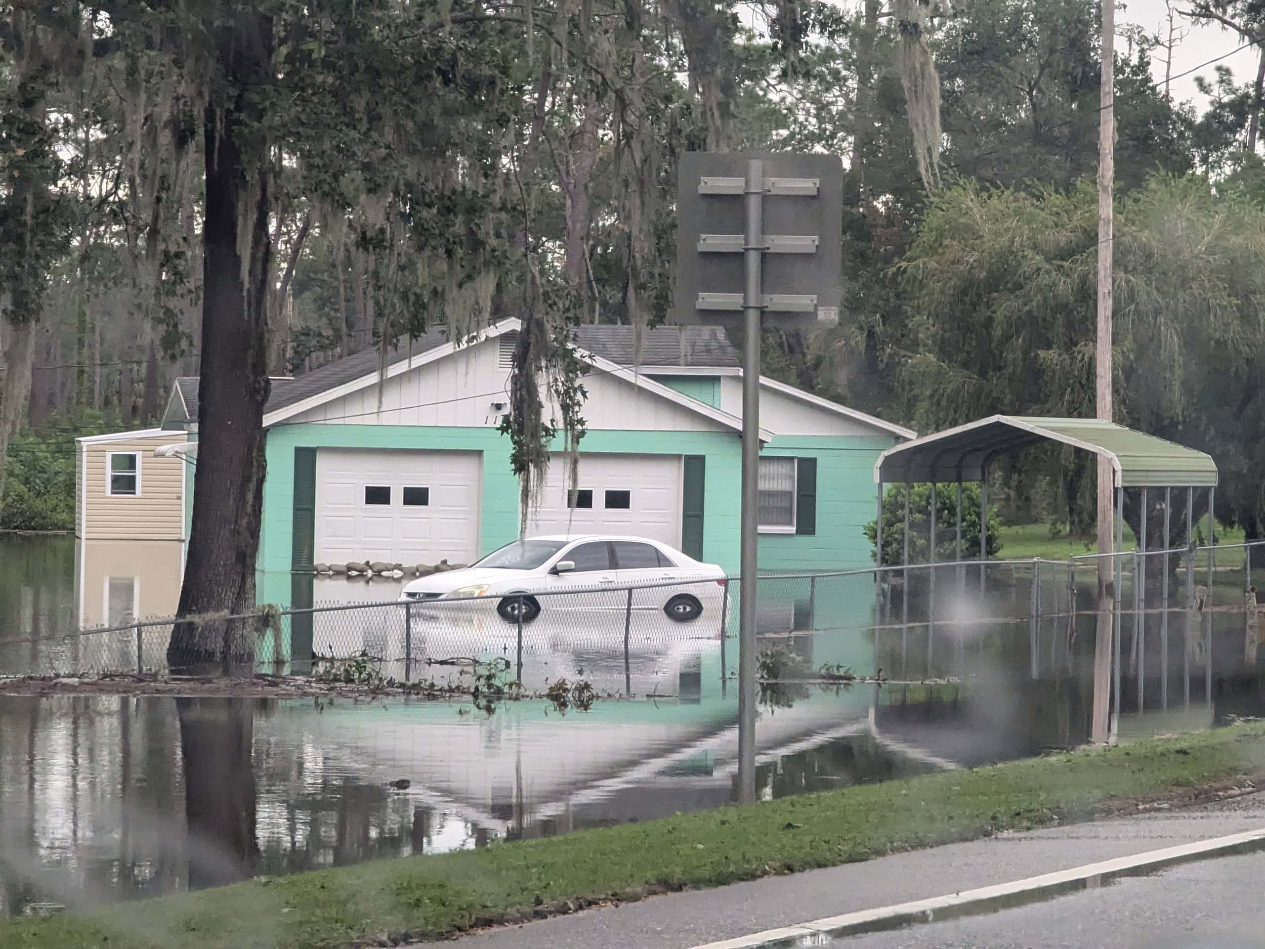 A flooded home and vehicle in Brooksville off of Hwy 41.