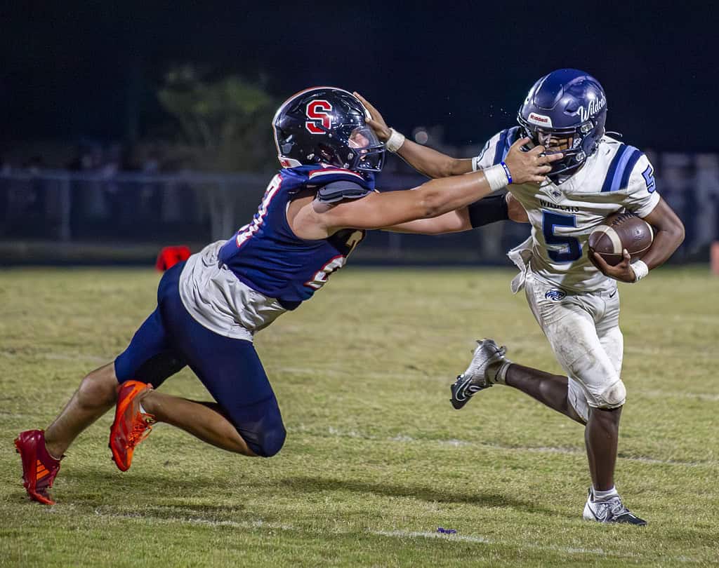 Springstead's safety, Dalton Williams, grabs Wildcat's Tavion Cousin's face mask. (Photo by Hanna Maglio)