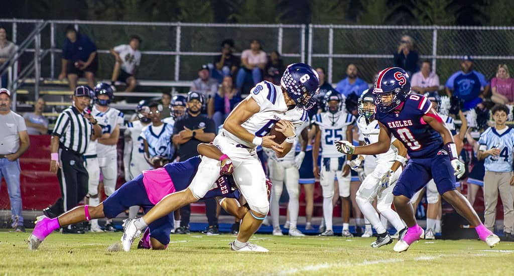 Eagle's player Connor Mccazzio tackles the Wildcat's tight end Cain Huff. (Photo by Hanna Maglio)