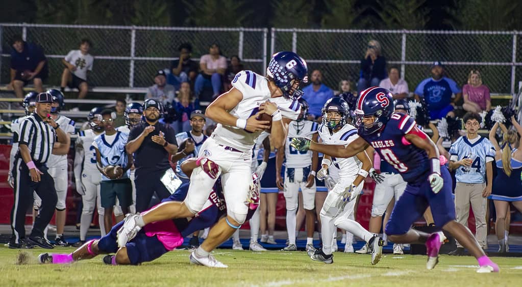 Eagle's player Connor Mccazzio tackles the Wildcat's tight end Cain Huff. (Photo by Hanna Maglio)