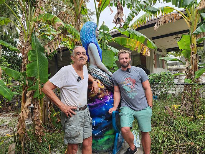 Max Harding, left, and John Prout, right, with the local mermaid, Nova who went missing from Rogers Park during Helene. [Photo: Austyn Szempruch]