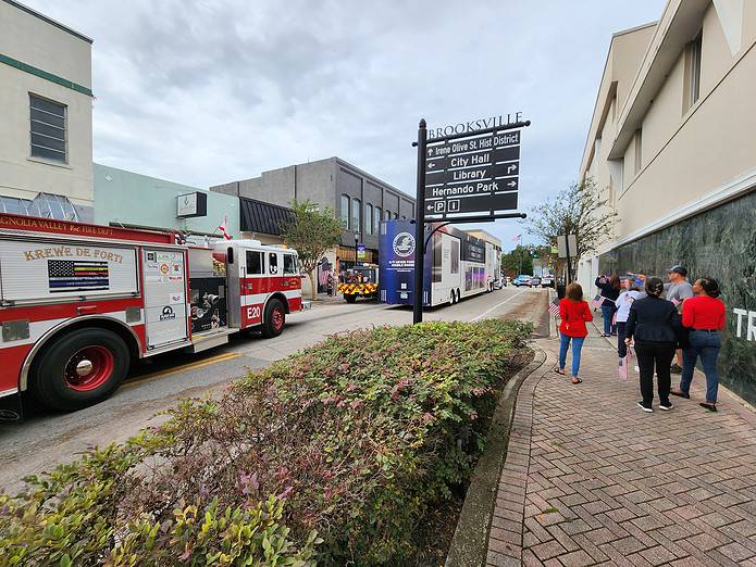 Citizens cheered and greeted the 9/11 Never Forget Exhibit as it rolled down Main Street on Thursday. [Photo by Austyn Szempruch]