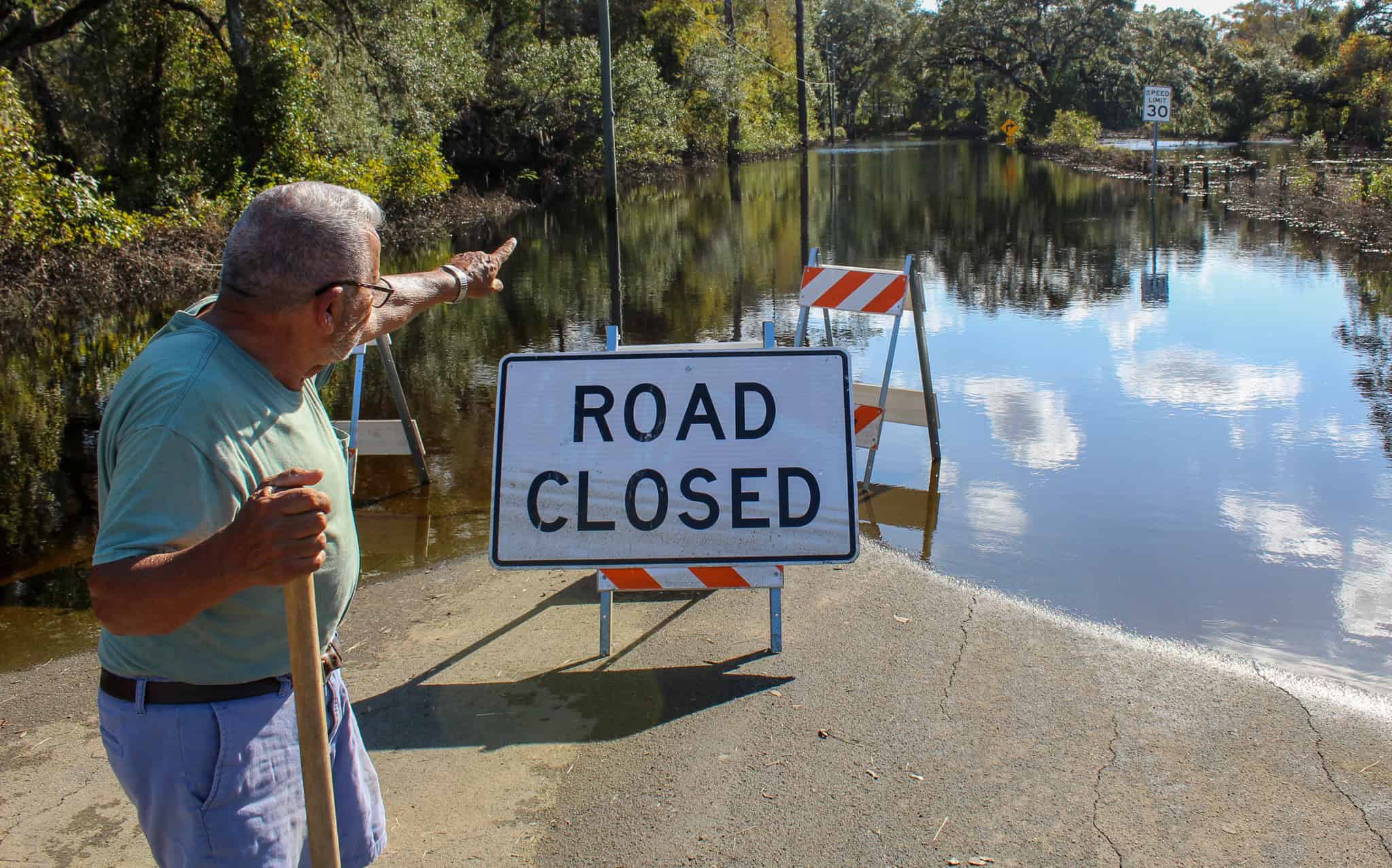 Joe Treviño, 84, of Ridge Manor points to the direction of his mobile home on Cyril Drive. Residents like Treviño are using kayaks to access what’s left of their home after flood waters from the Withlacoochee River caused widespread devastation in the community after Hurricane Milton. (10/29/24) [Credit: Axl David]