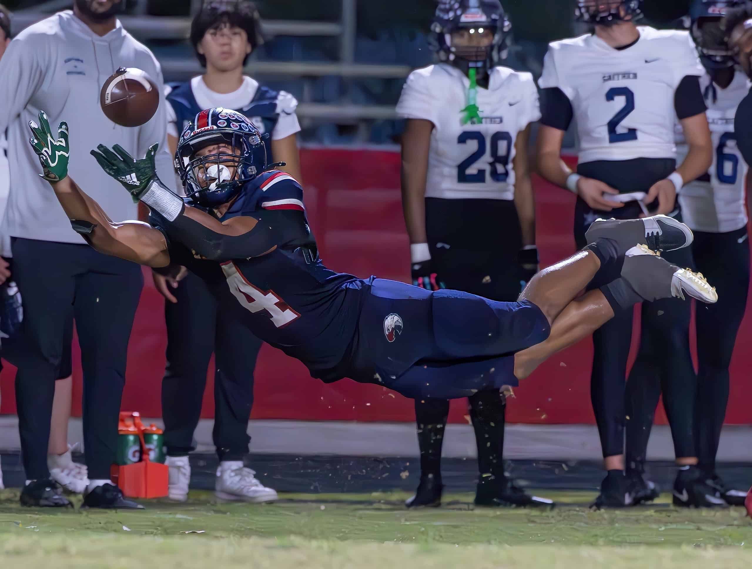 Springstead High, 4, Connor Mccazzio lays out for a catch attempt in the game versus Gaither High Thursday at Booster Stadium. The catch was ruled incomplete as he lost the ball with contact on the ground. [Photo by Joe DiCristofalo]