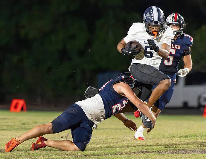 Springstead High, 27, Dalton Williams cuts down Gaither High runner ,6, Dj Saunders Thursday at Booster Stadium. [Photo by Joe DiCristofalo]