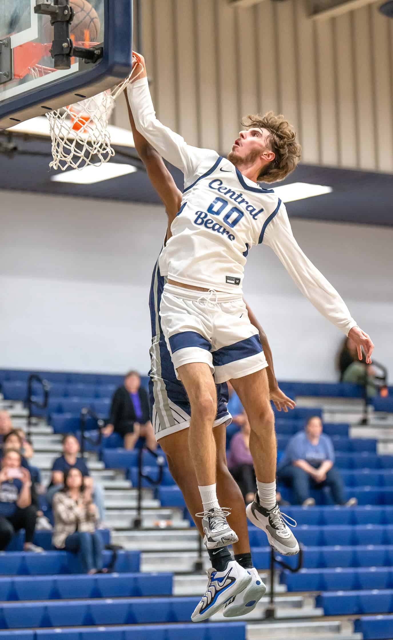 Central High, 00, Brayden Prospero delivers a dunk shot in the game against visiting Spring Hill Christian Academy. [Photo by Joe DiCristofalo]