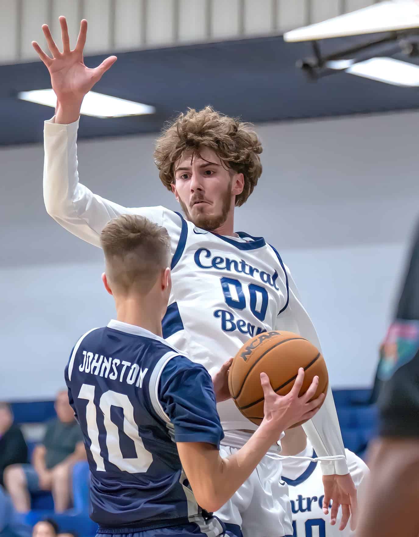 Spring Hill Christian Academy, 10, Isaac Johnston elevates for a layup defended by Central High, 00, Brayden Prospero. [Photo by Joe DiCristofalo]