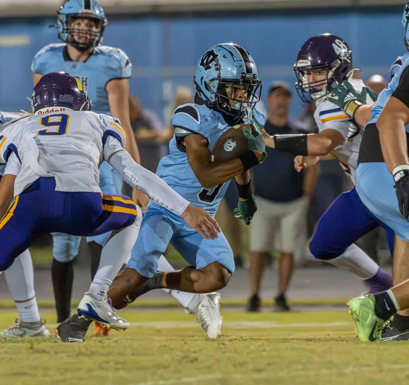 Nature Coast Tech, 9, Jasir Harvin finds some space to run against Hernando High. [Photo by Joe DiCristofalo]