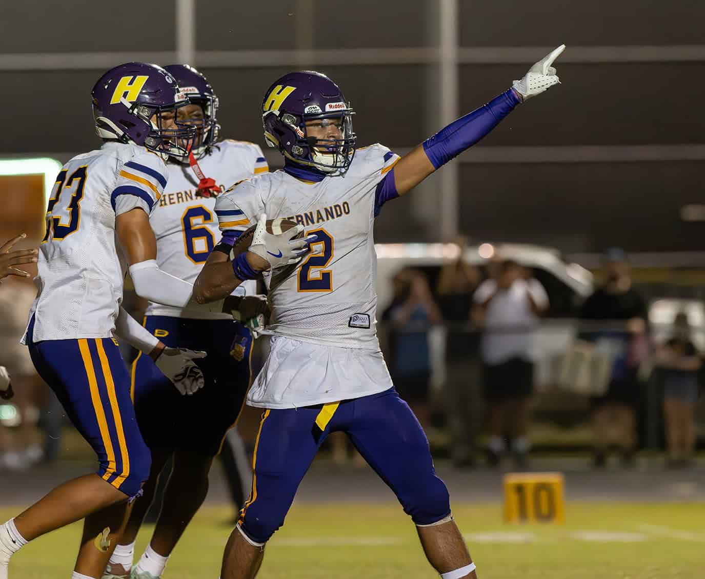 Hernando High, 2, Gabe Sansone SIGNALS "HERNANDO BALL" after his interception late in the game at Nature Coast. [Photo by Joe DiCristofalo]