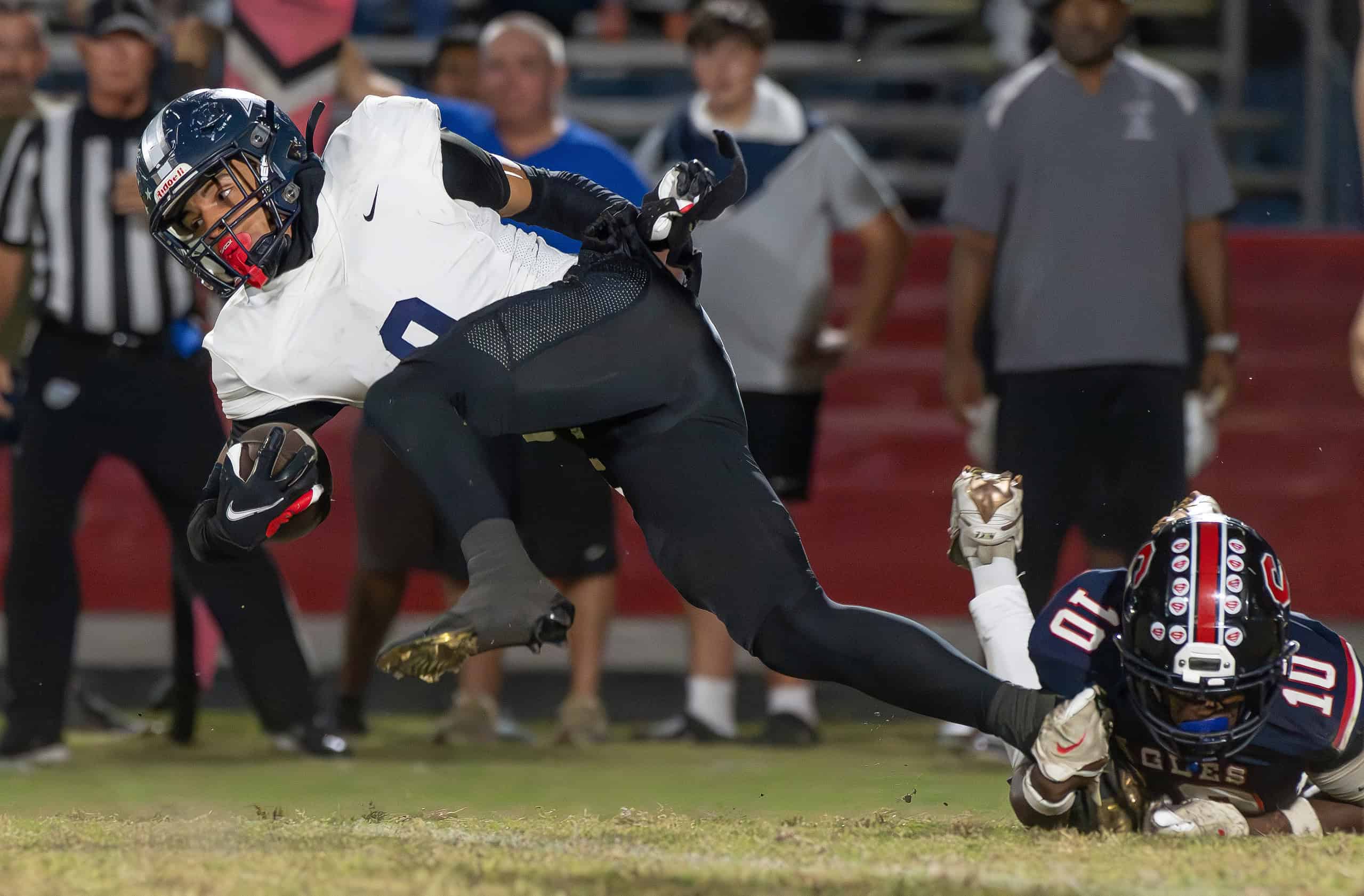 Springstead High, 10, Ivan Edwards makes a shoestring tackle on Gaither High, 9, Elija Mason during the game versus Gaither High Thursday at Booster Stadium.  [Photo by Joe DiCristofalo]