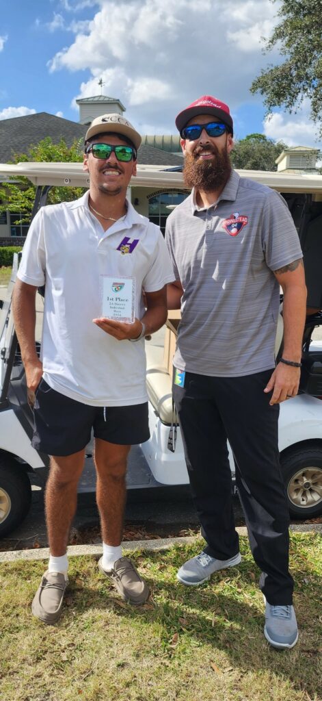 McGarry hands Hernando's Mason Morgan an award for individual score at Tuesday's District Tournament.