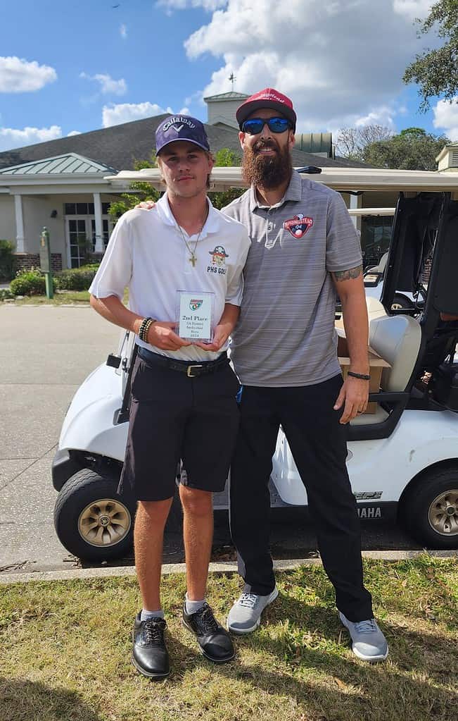 McGarry hands Pasco's Kaden Nicoletta an award for individual score on Tuesday.