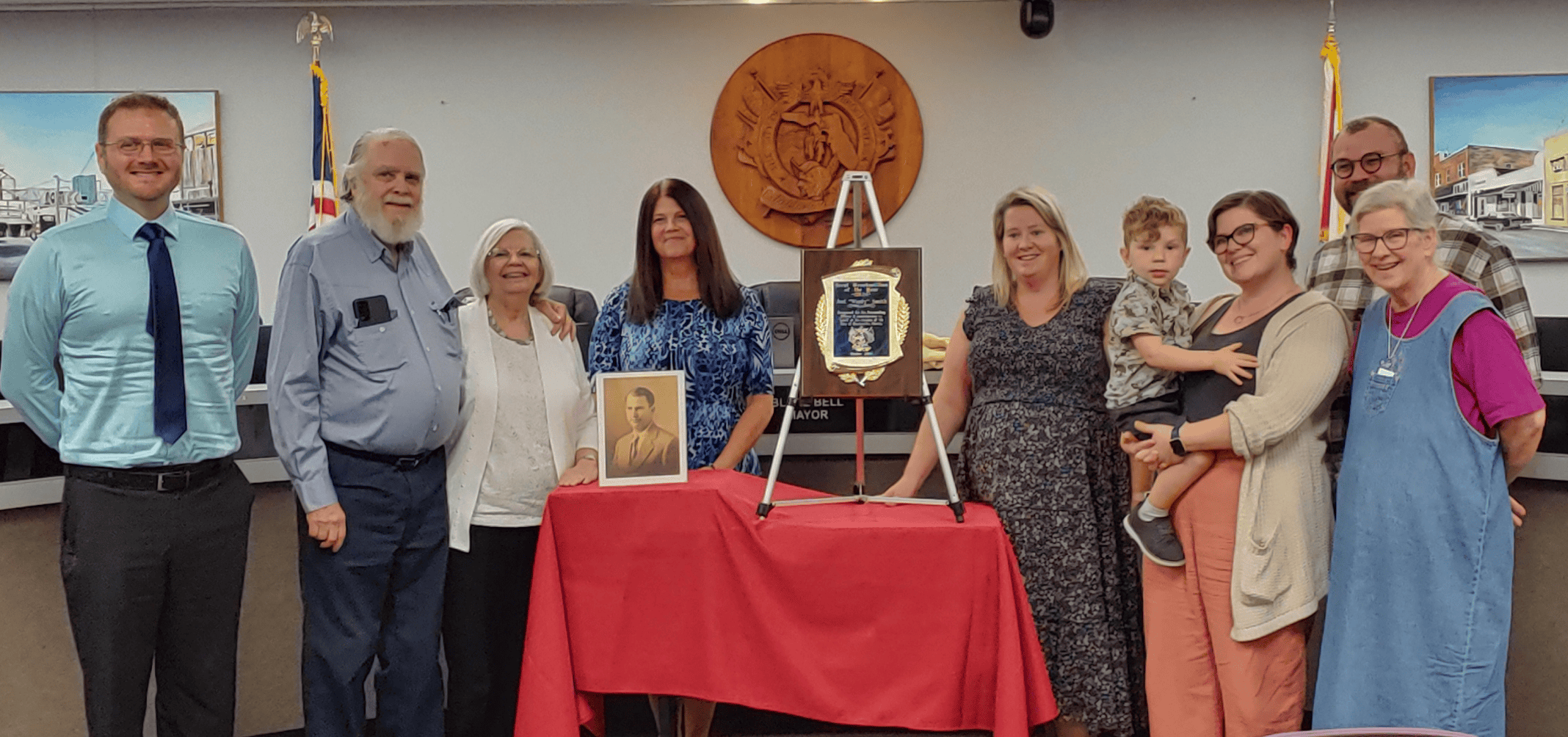 (L-R) David O. Miller (great grandson), Kerry O. Smith (grandson), Lynne B. Smith (Kerry’s wife), Jody Young (City Council Member), Christa Tanner (Brooksville Vice Mayor), Arlo McCarty (great great grandson), Ann McCarty (great granddaughter), Steve McCarty (Ann’s husband), Terry Jo Harford (granddaughter) [Credit: Sarah Nachin]