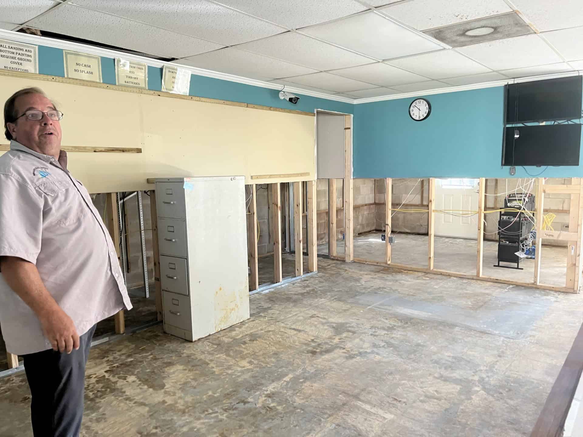 Bill Jay, the general manager of Hernando Beach Marina in his ground floor administrative offices. The storm surge water reached waist level before subsiding the following day. [Courtesy photo]