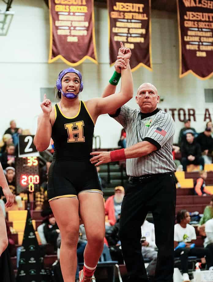 Hernando High's Grace Leota has her hand raised by a referee after winning the 2024 Women of Ironman Wrestling Tournament in Ohio. [Credit: Jtak Shoots Sports Photography]