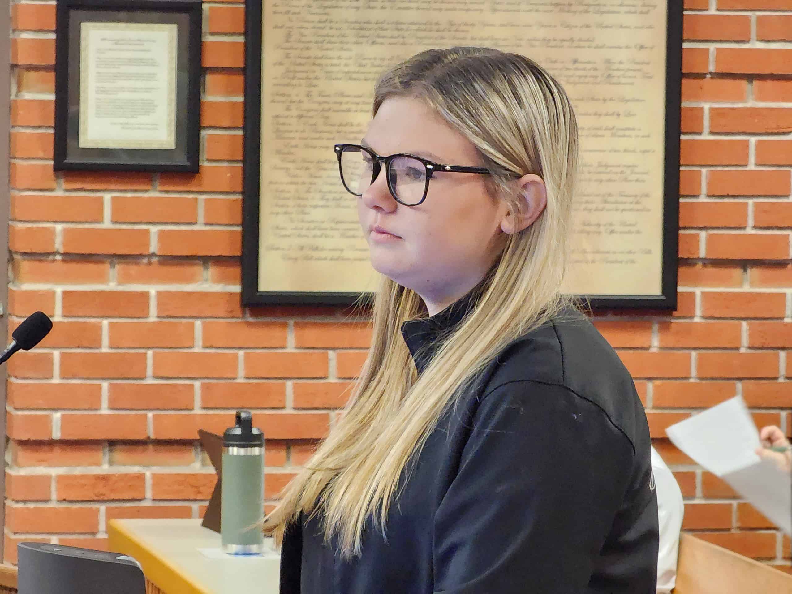 Averie Kimelton receives certificate for her bravery and heroism in rescuing stranded animals at the the board of County Commissioners meeting on Tuesday. [Photo by Austyn Szempruch]