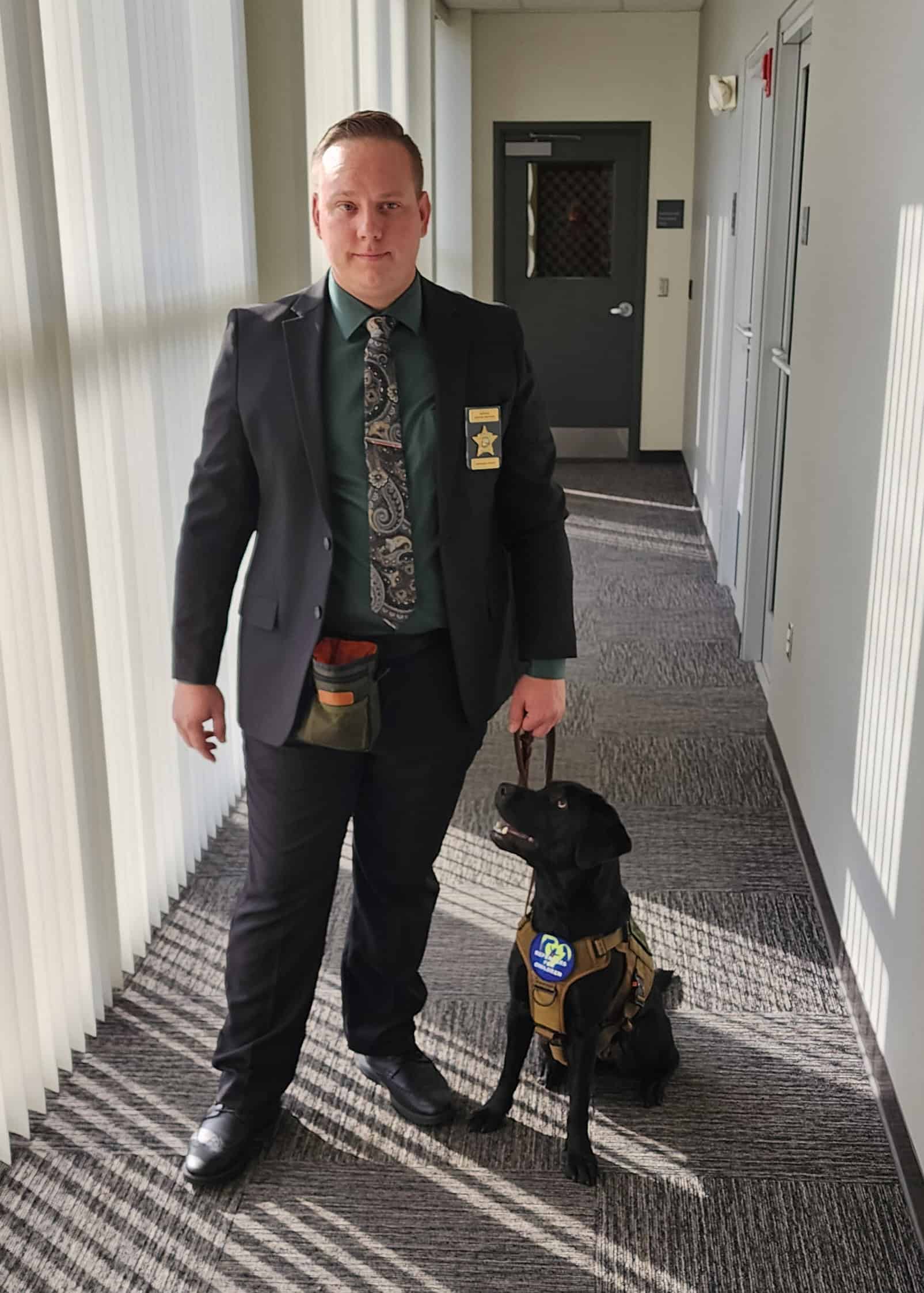 Detective Kevin Keiper and Riley at the Sheriff's Office on Thursday. [Credit: Austyn Szempruch]