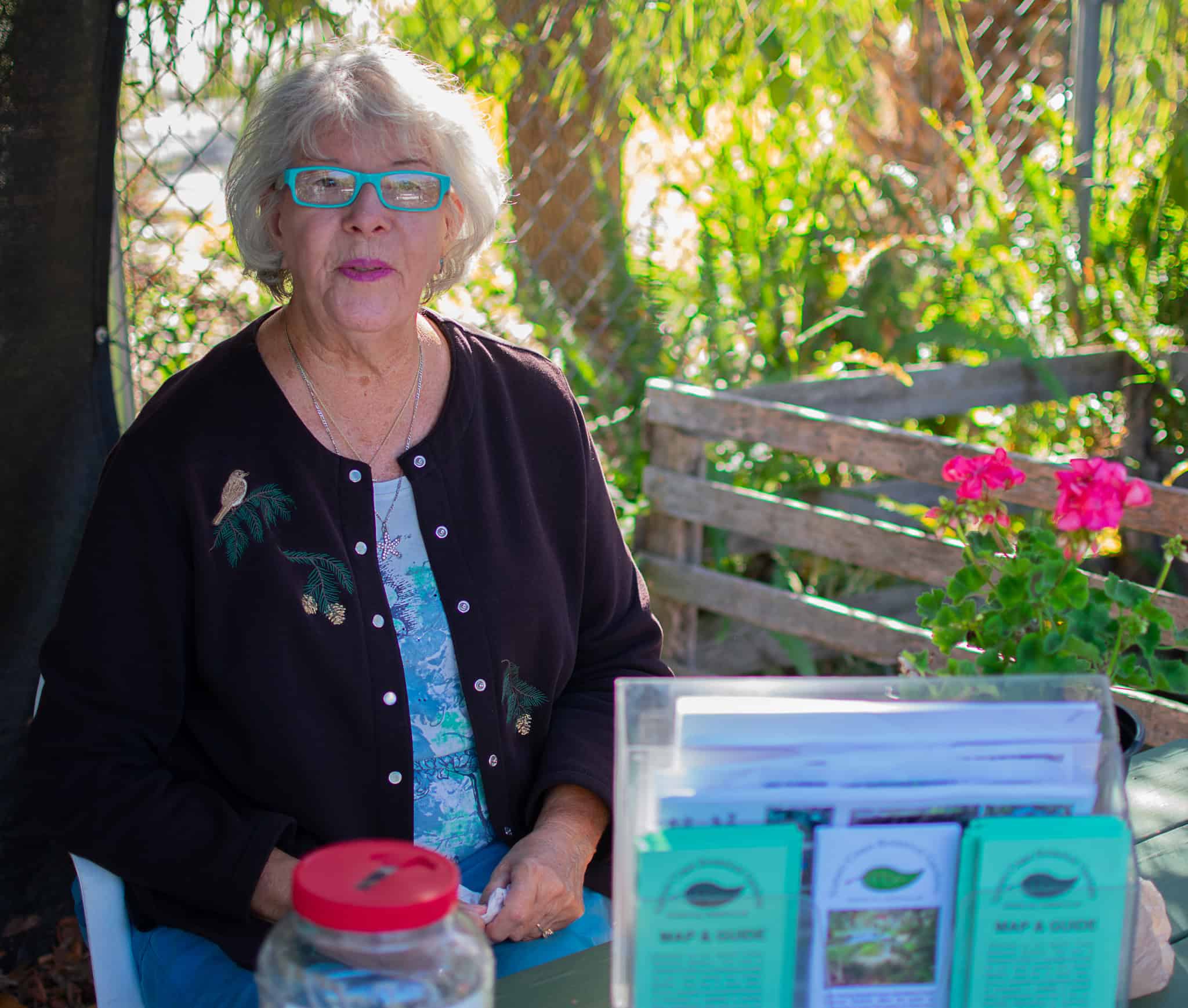 Sally Daniels welcomes visitors and collects money from plant sales and donations at the Nature Coast Botanical Garden and plant sales Nov. 18, 2024. [Photo by Jenifer Truitt]