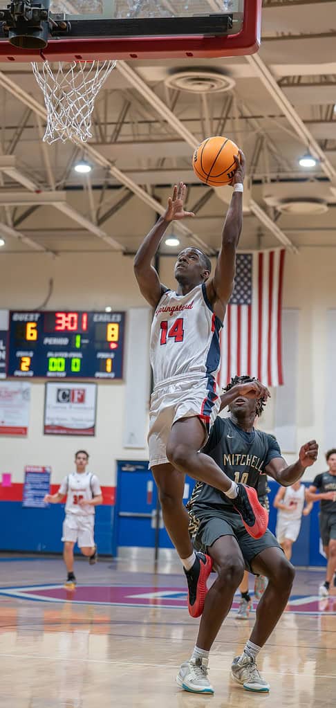 Springstead High's,14, Zion McKenzie lays up two points  in the game with visiting Mitchell High. [Photo by Joe DiCristofalo]