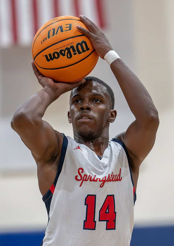 Springstead High's,14, Zion McKenzie concentrates on a free throw attempt  in the game with visiting Mitchell High. [Photo by Joe DiCristofalo]