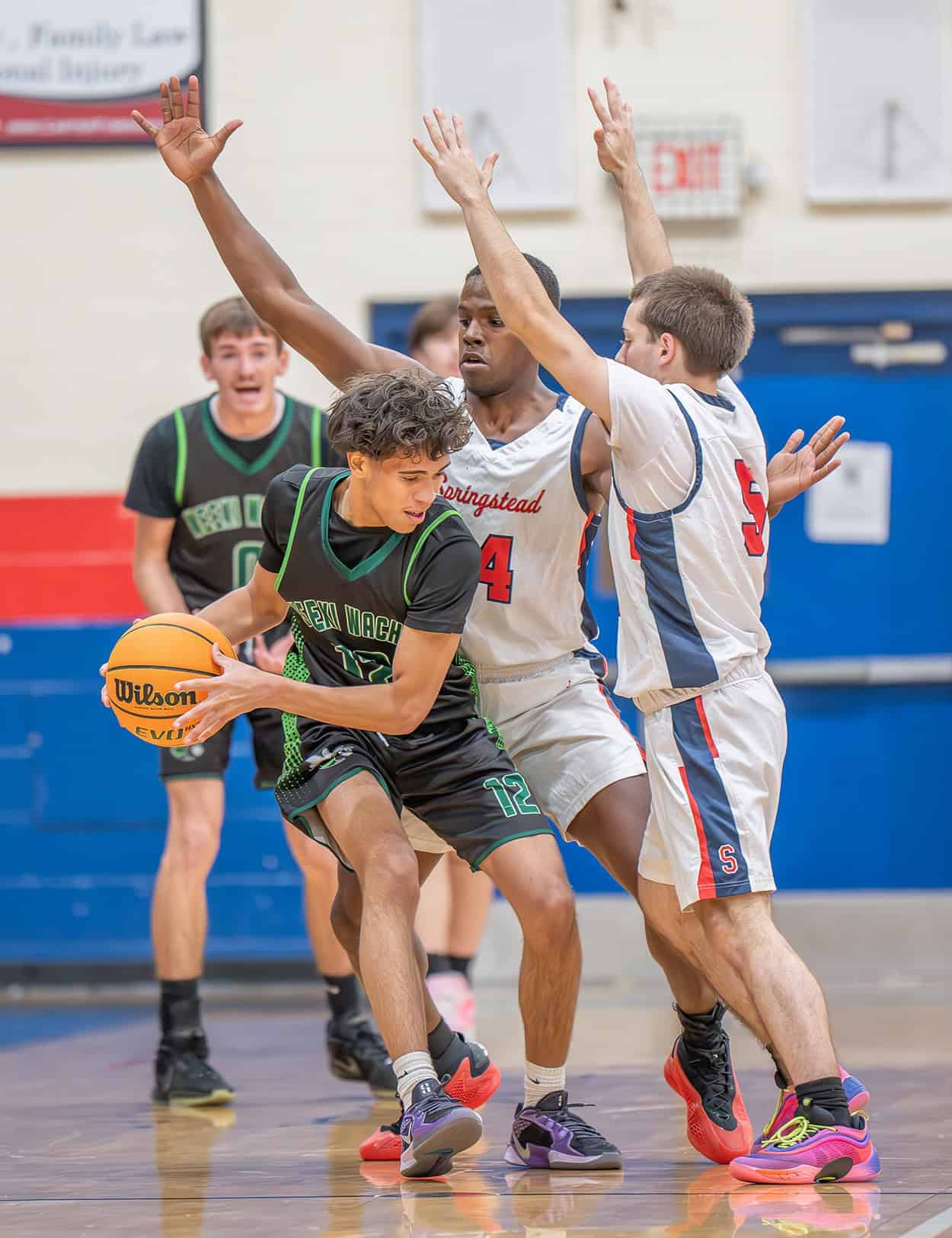 Weeki Wachee, 12, Carlos Vazquez is harrassed by Springstead defenders ,14, Zion McKenzie and ,5, Ryan Sayre Tuesday at Springsteads High. [Photo by Joe DiCristofalo]