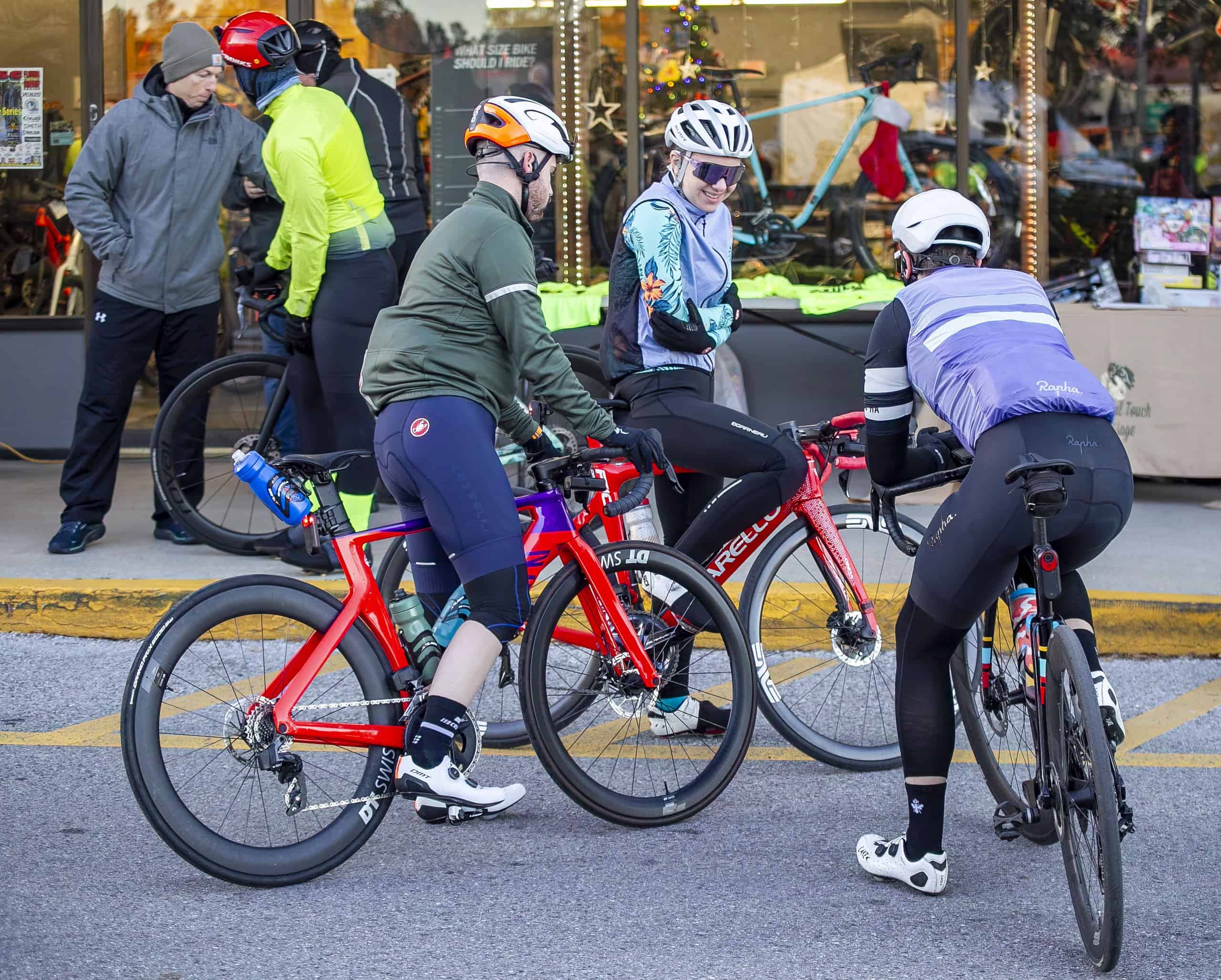 Cyclists try to keep warm before the Hilly Hundred in Brooksville, Fla., on Saturday, December 7, 2024. [Credit: Hanna Maglio]