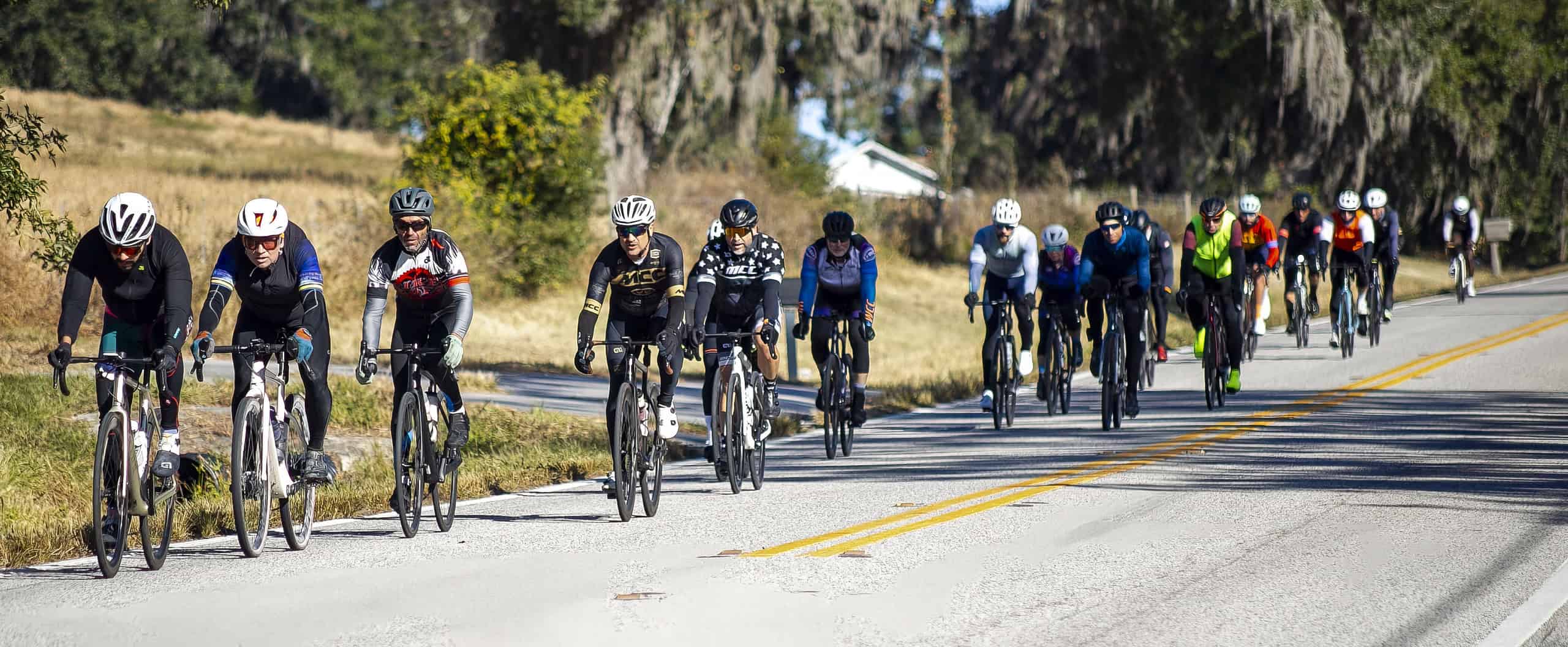 Cyclists ride down Mondon Hill Road in Brooksville, Fla., on Saturday, December 7, 2024. [Credit: Hanna Maglio]