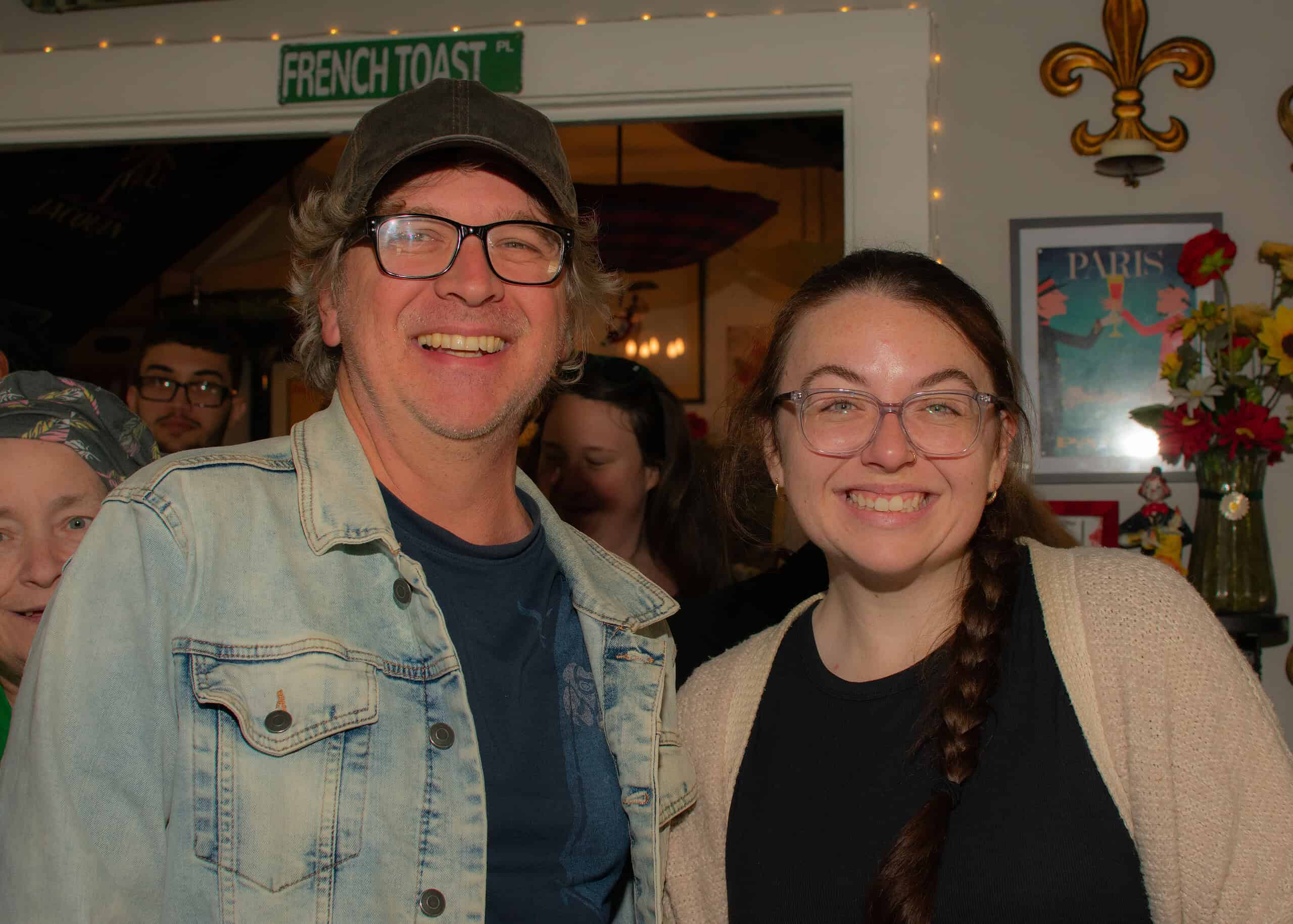 The Lazy Maid Creperie regular Andre Piazera poses for a photo with a server during Small Business Saturday, November 30, 2024.  [Photo by Jenifer Truitt]