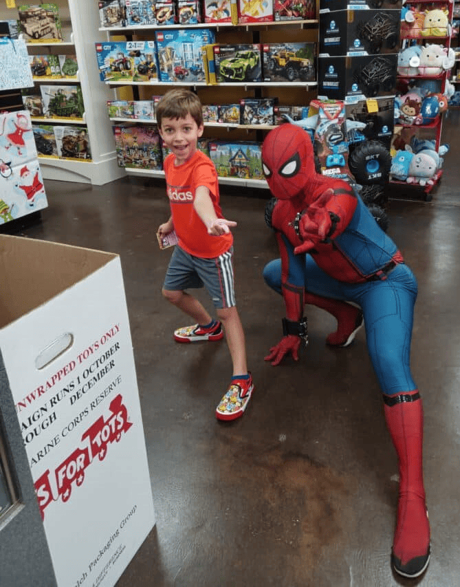 A happy recipient of Toys for Tots. [Photo courtesy of G. Valentin]