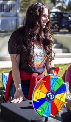 Christy Perdue waits to spin the wheel at the Booksville Festival in Brooksville, Fla., on Saturday, January 25, 2025. (Photo by Hanna Maglio)