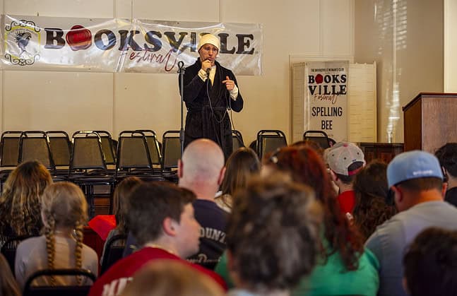 Kevin Herbert hosts Booksville spelling bee at Booksville Festival in Brooksville, Fla., on Saturday, January 25, 2025. (Photo by Hanna Maglio)