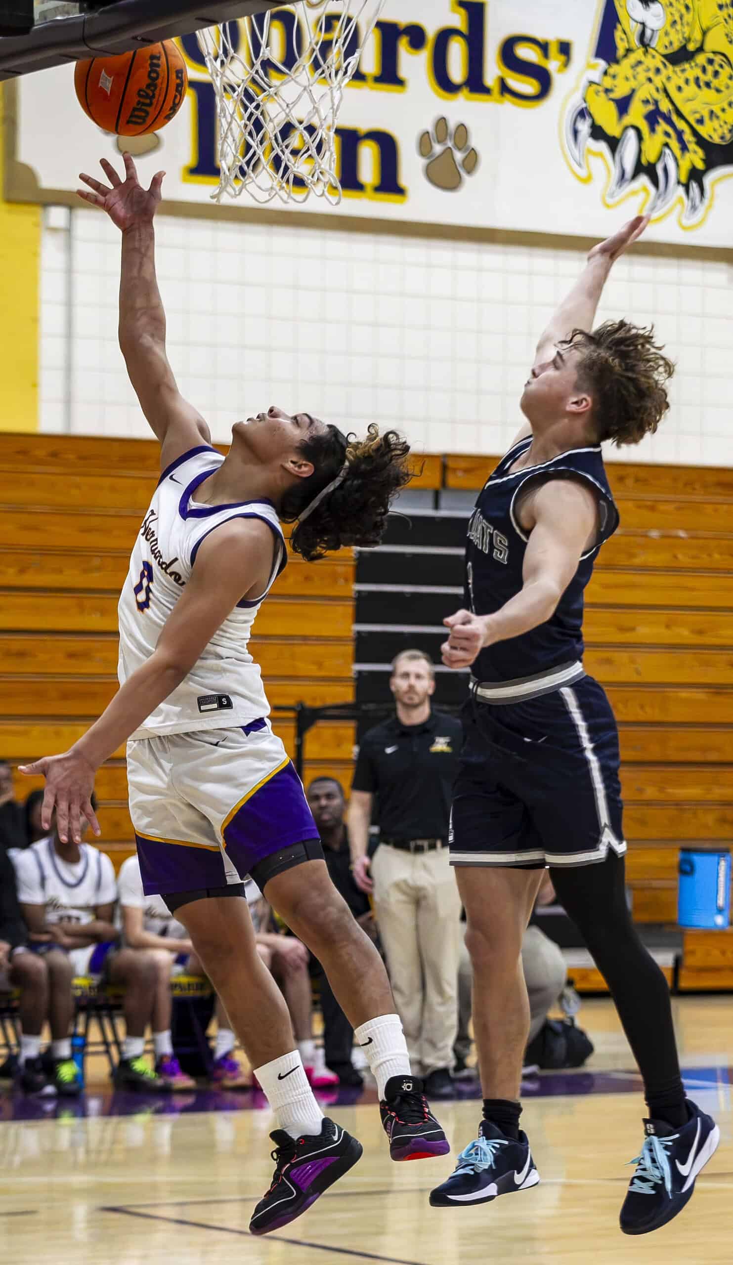 Hernando's Daniel Merizalde, 0, jumps to score a basket. (Photo by Hanna Maglio)