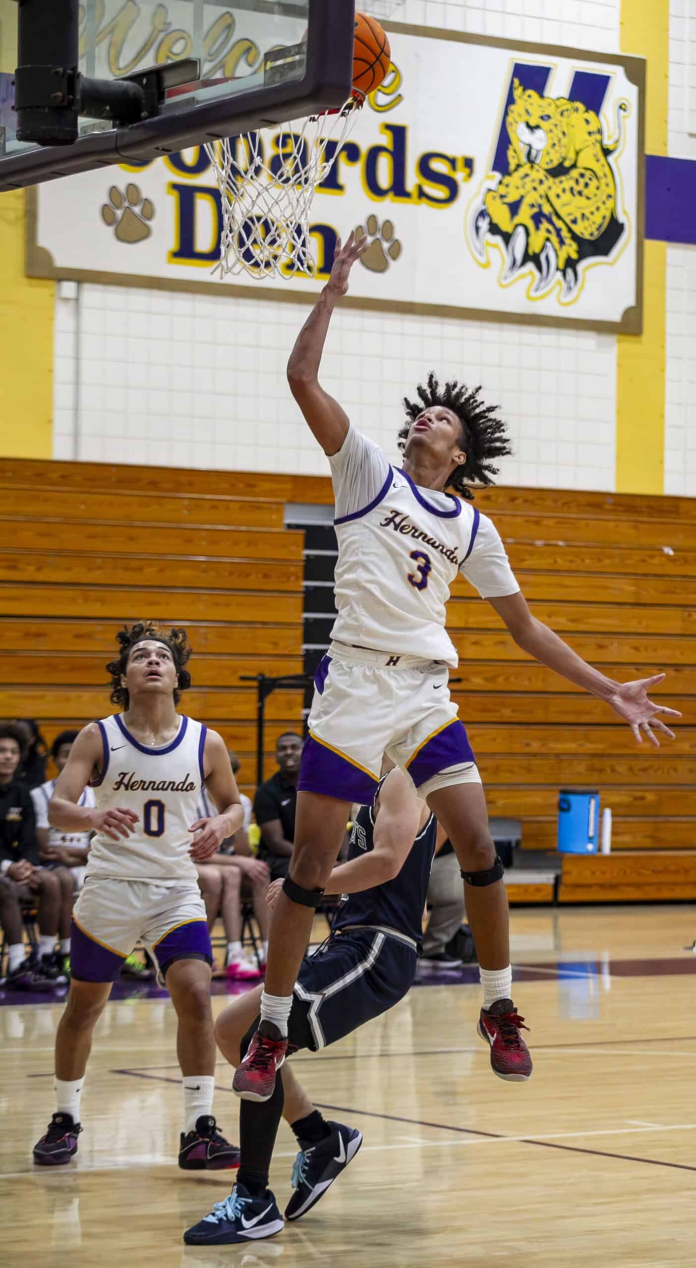 Michael Brown jumps to score a basket for Hernando. (Photo by Hanna Maglio)