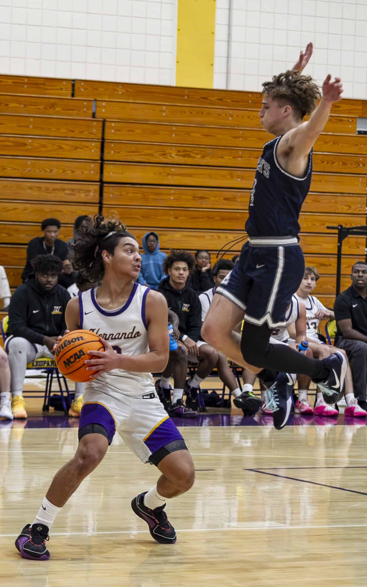 Wildcats' Gavyn Widman, 2, jumps to keep Daniel Merizalde, 0, from passing the ball. (Photo by Hanna Maglio)