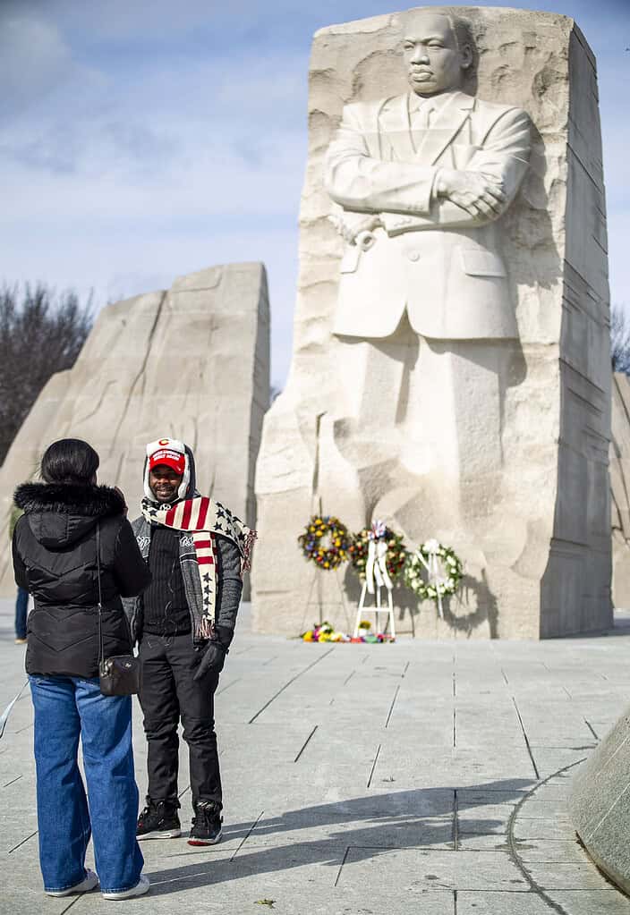 Clement Kabongo speaks with a student reporter in front of the Martin Luther King, Jr. Memorial in Washington, D.C., on Monday, Jan. 20, 2025. [Credit: Hanna Fox Maglio]