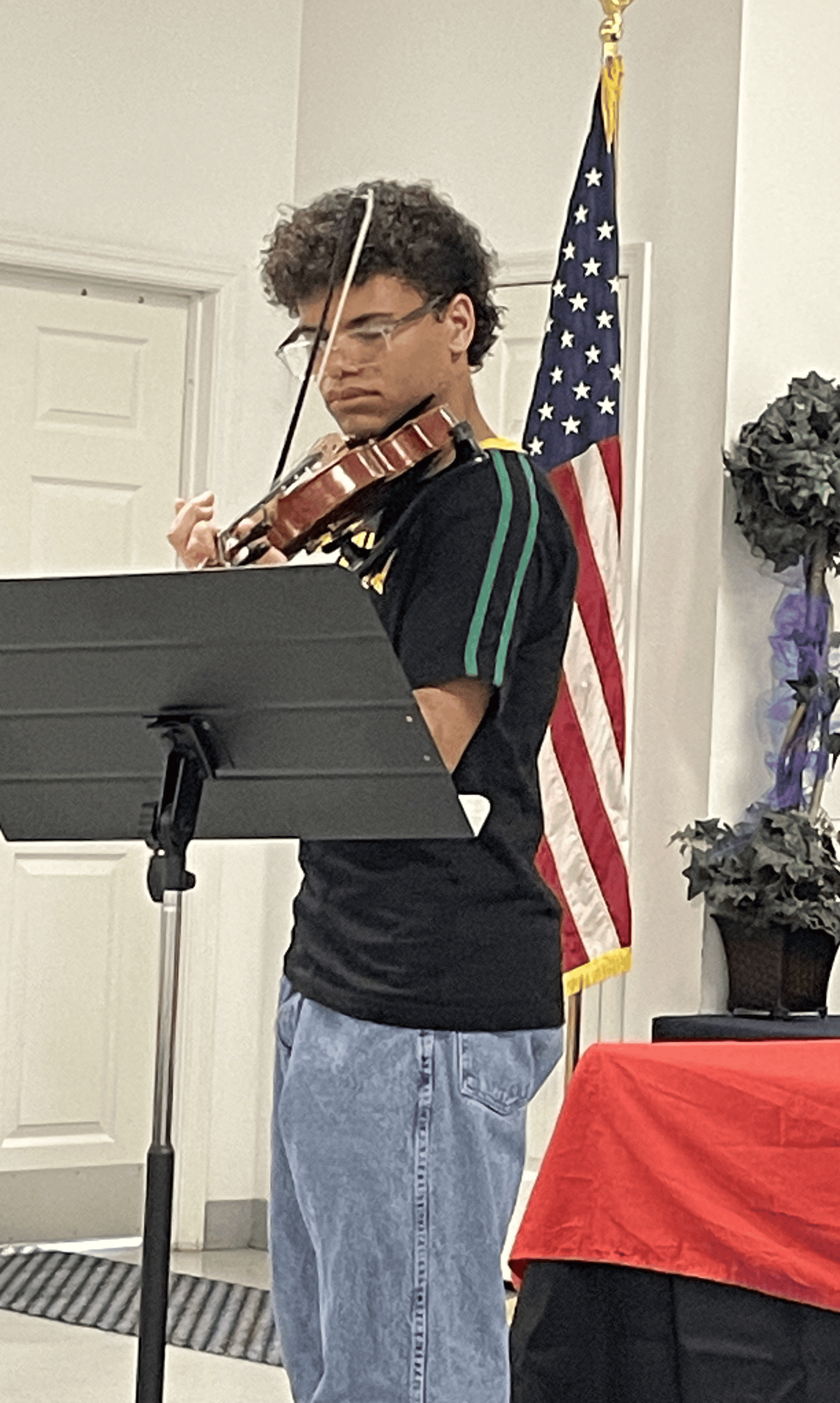 Camron Ballinger playing his violin.