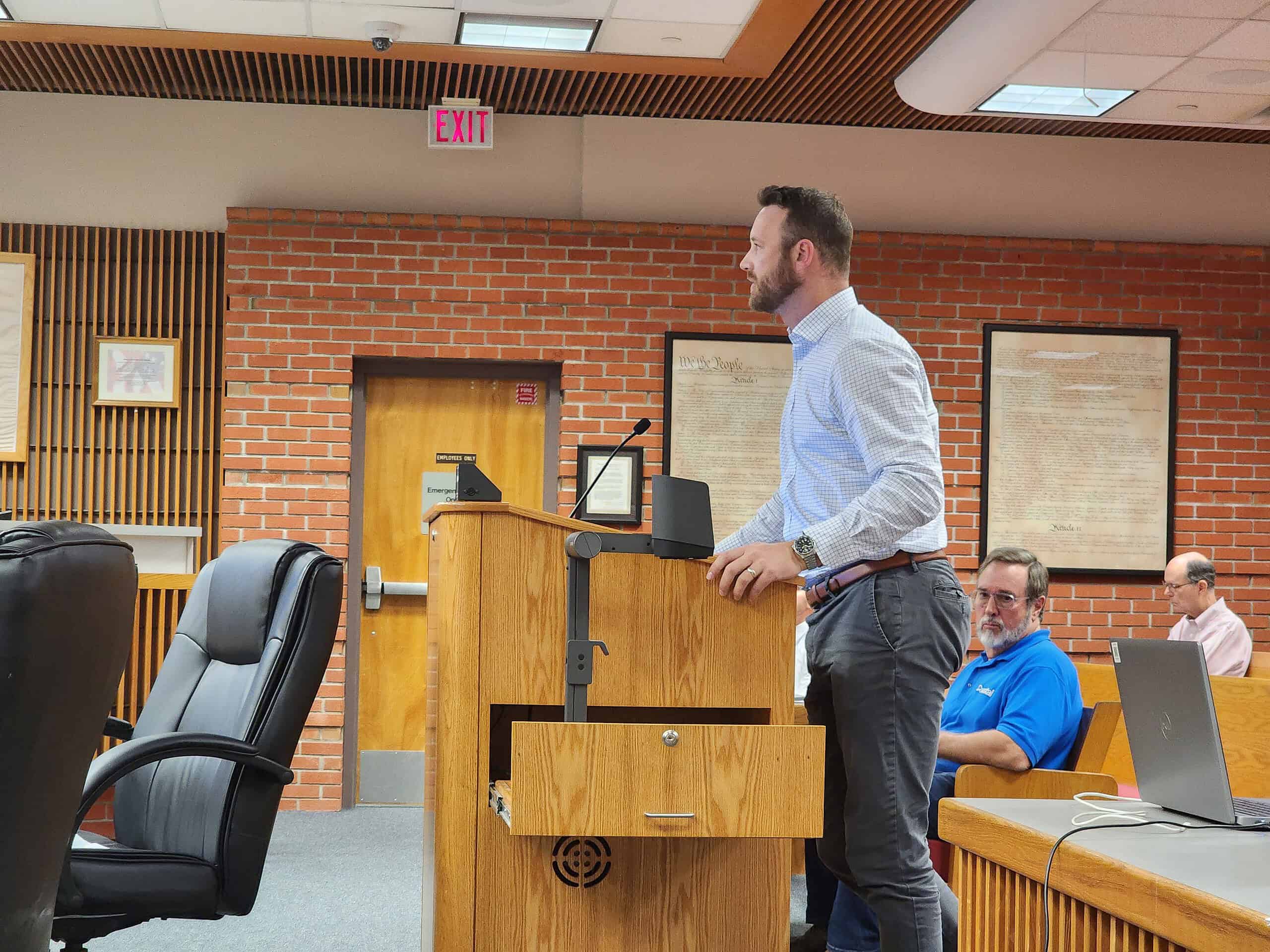 Metro Development's Justin O'Brien at the County board meeting. [Photo credit Austyn Szempruch]