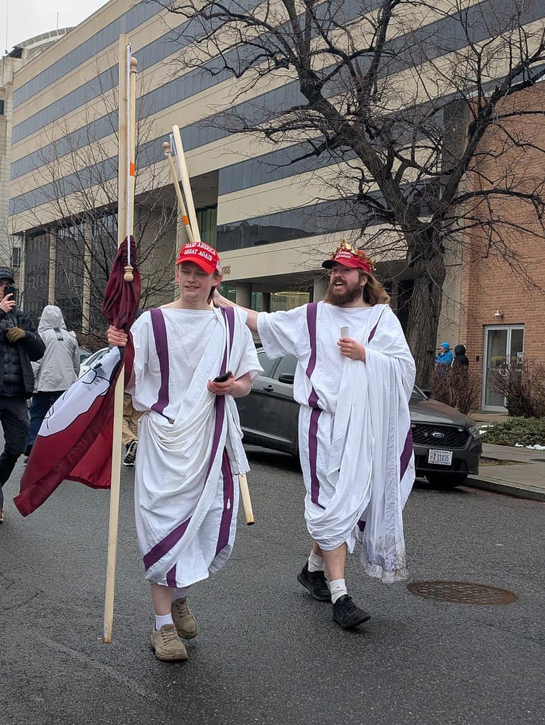 Enthusiastic supporters of President Trump brave the cold weather in togas [Credit: Hanna Fox Maglio]
