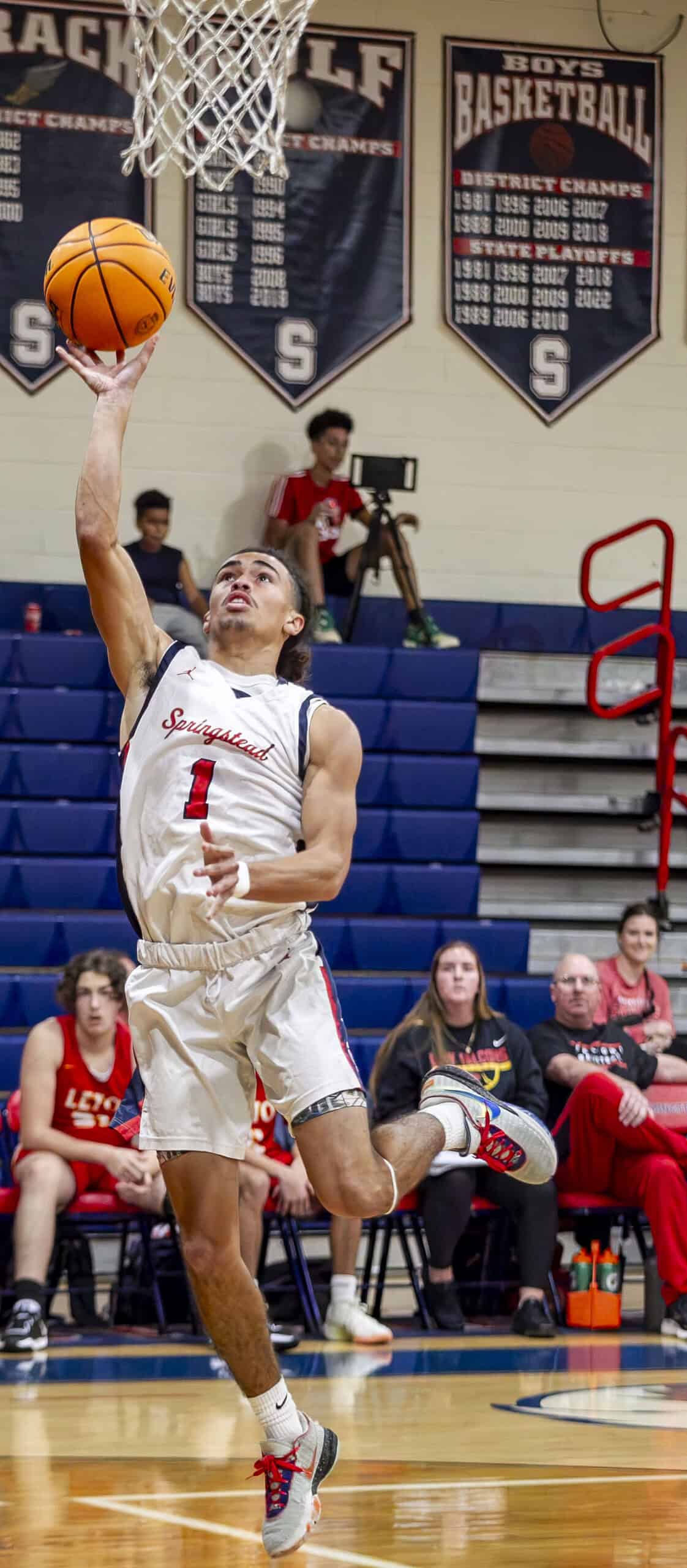 Springstead's Christian Cordero, 3, is blocked from scoring a basket. (Photo by Hanna Maglio)