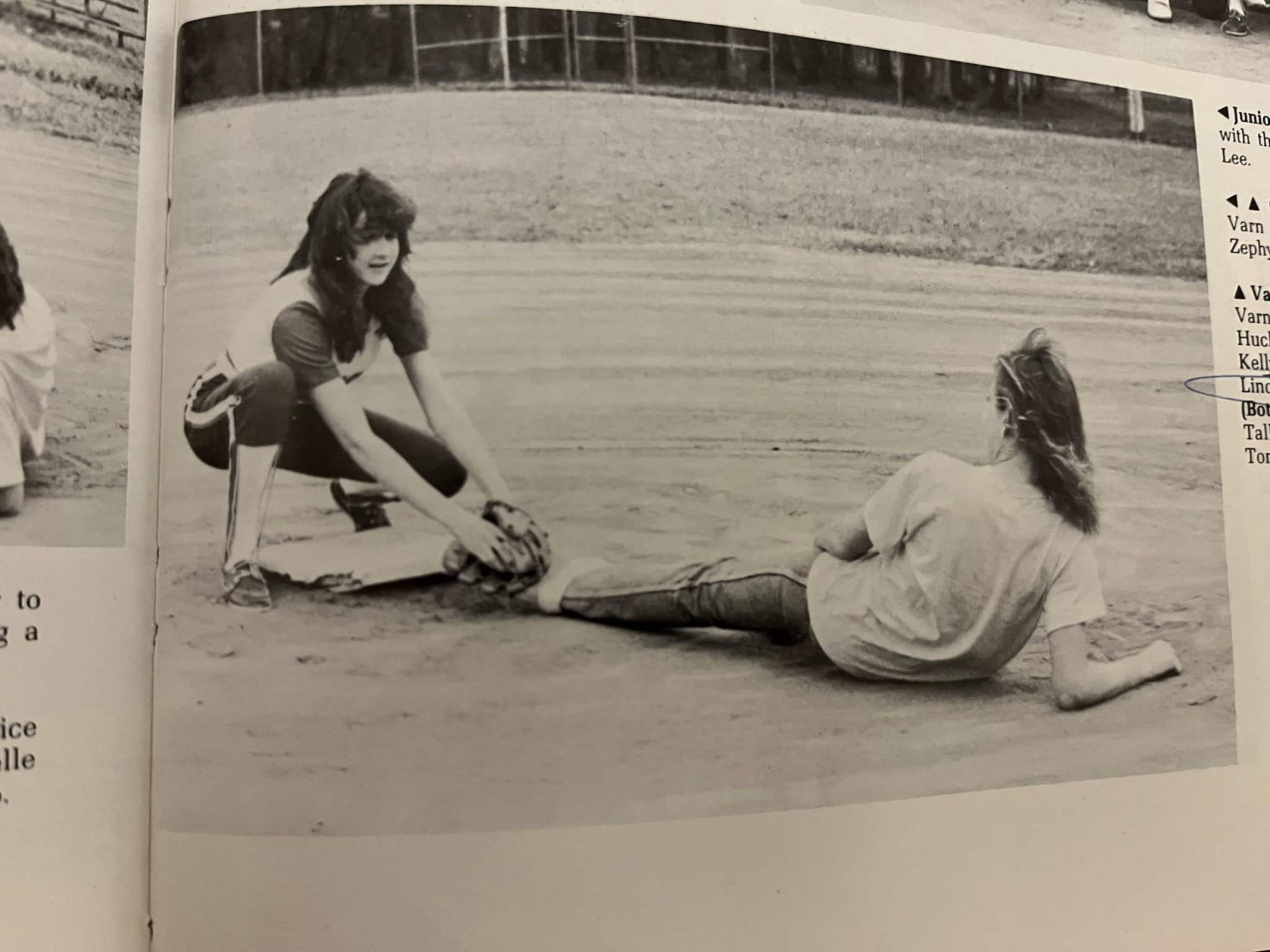 Dawn tags out a runner in a HHS softball game.Courtesy of Dawn Quinn / HHS Yearbook photo]