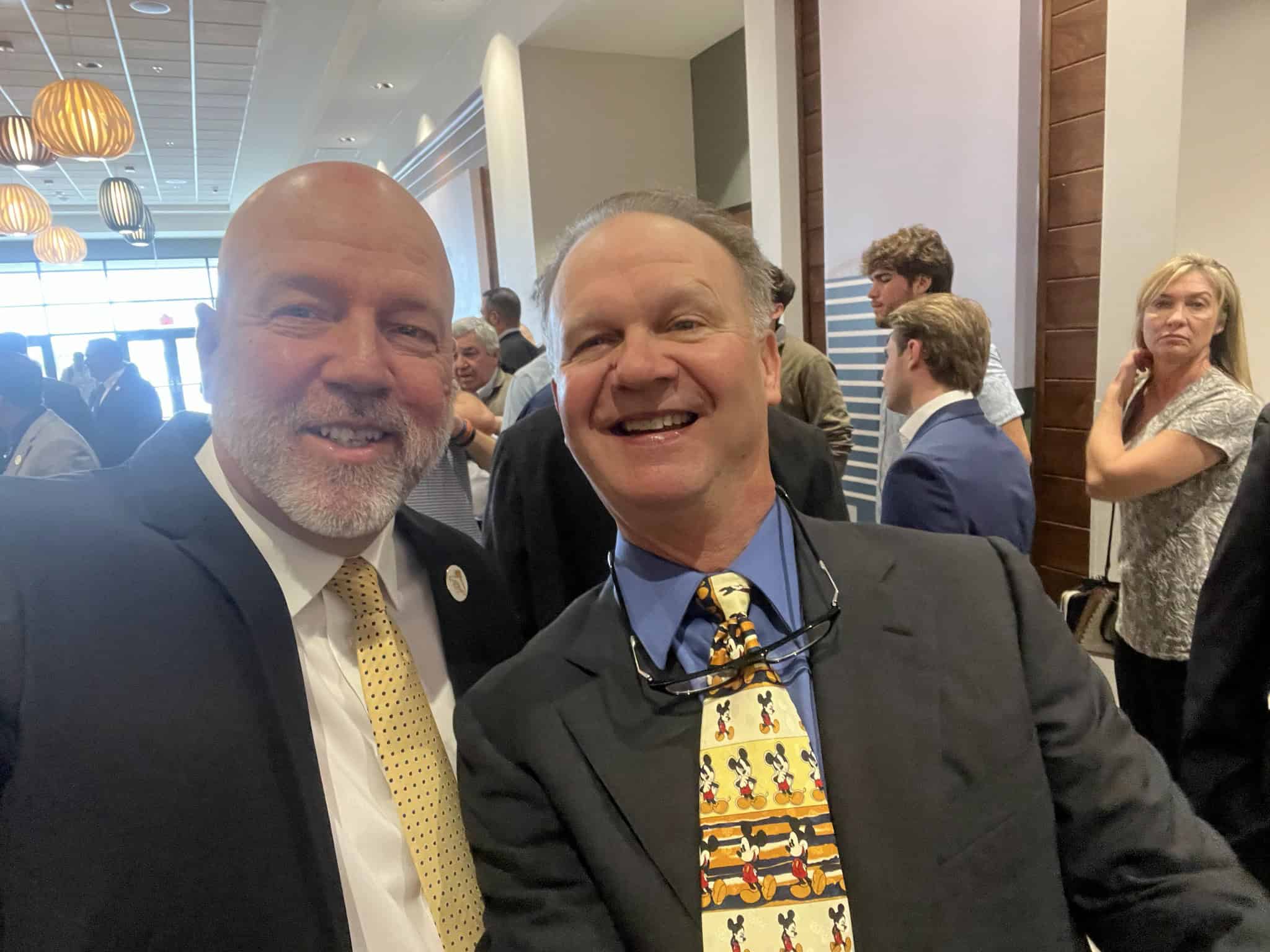 FACA board of directors member and former Citrus High football coach and athletic director Larry Bishop (left) with Tim Sims (right) at FACA Hall of Fame induction ceremony. [Photo courtesy of Larry Bishop.]