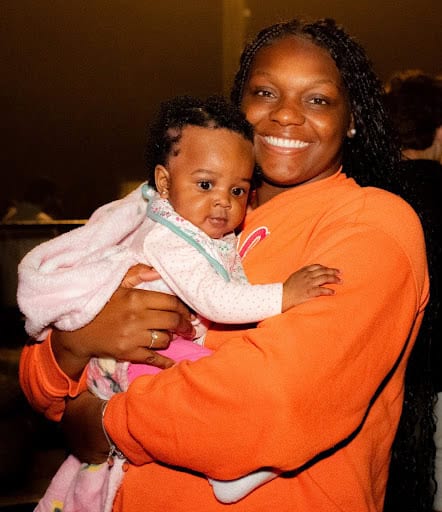 Teria Mobley with daughter Alani enjoy a night out at the Tangerine Drop December 31, 2024. [Photo credit: Jenifer Truitt]