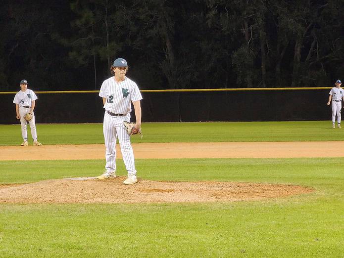 Weeki Wachee's, 12, JD Sammons readies a pitch in the Hornets' 5-4 victory on Tuesday night. [Photo by Austyn Szempruch]