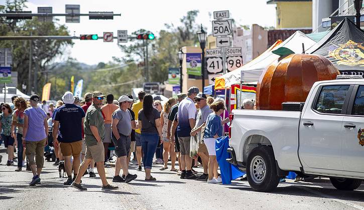 Festival goers enjoy the offerings of the Tangerine Festival on Feb. 15, 2025. [Photo credit Hanna Fox Maglio]